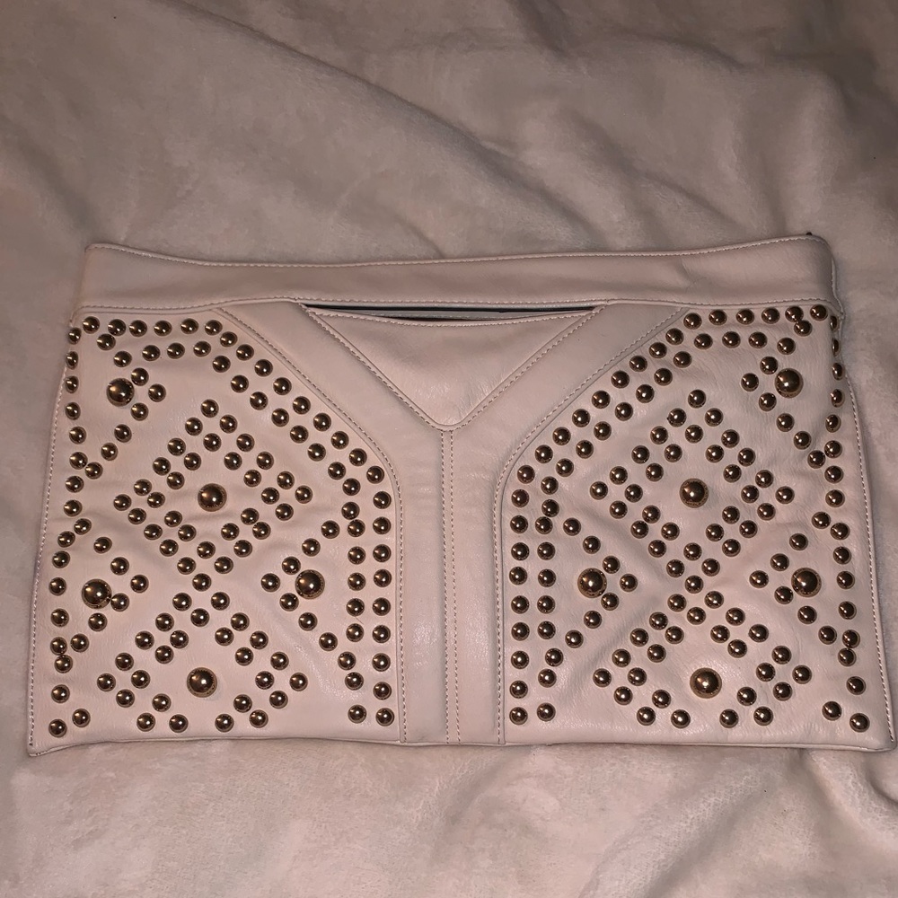 Oversized cream clutch